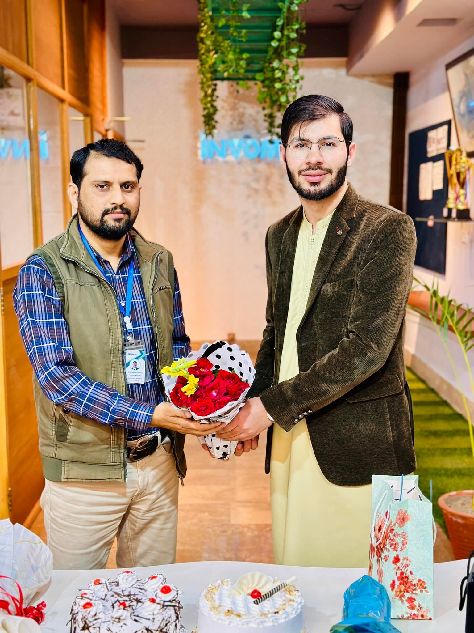 Team members celebrating a birthday at the office